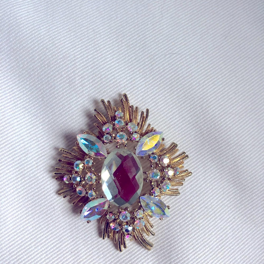 A B rhinestone brooch